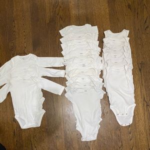 bundle of white onsies